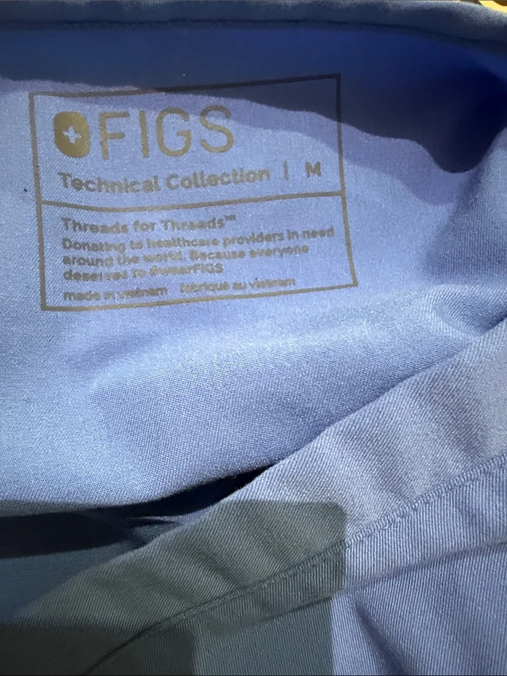 Figs V-Neck Scrub Top in capri blue. Size M. Excellent condition